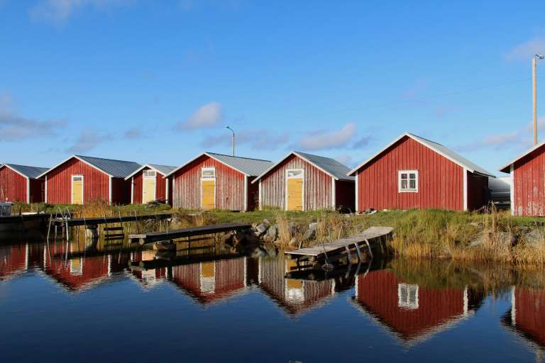 Boat houses by the water