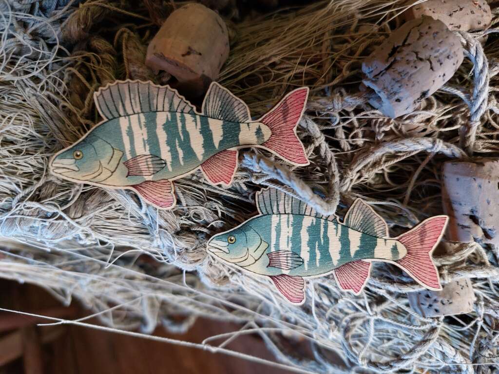 Two perch mase of plywood and placed on top of an old fishing net.